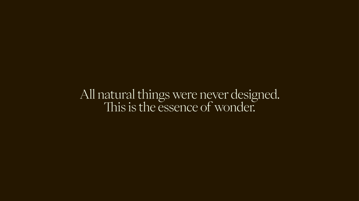 Graphic text 'All natural things were never designed. This is the essence of wonder.'