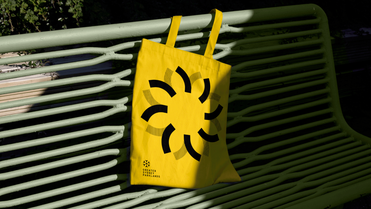 Greater Sydney Parklands yellow tote bag on park bench