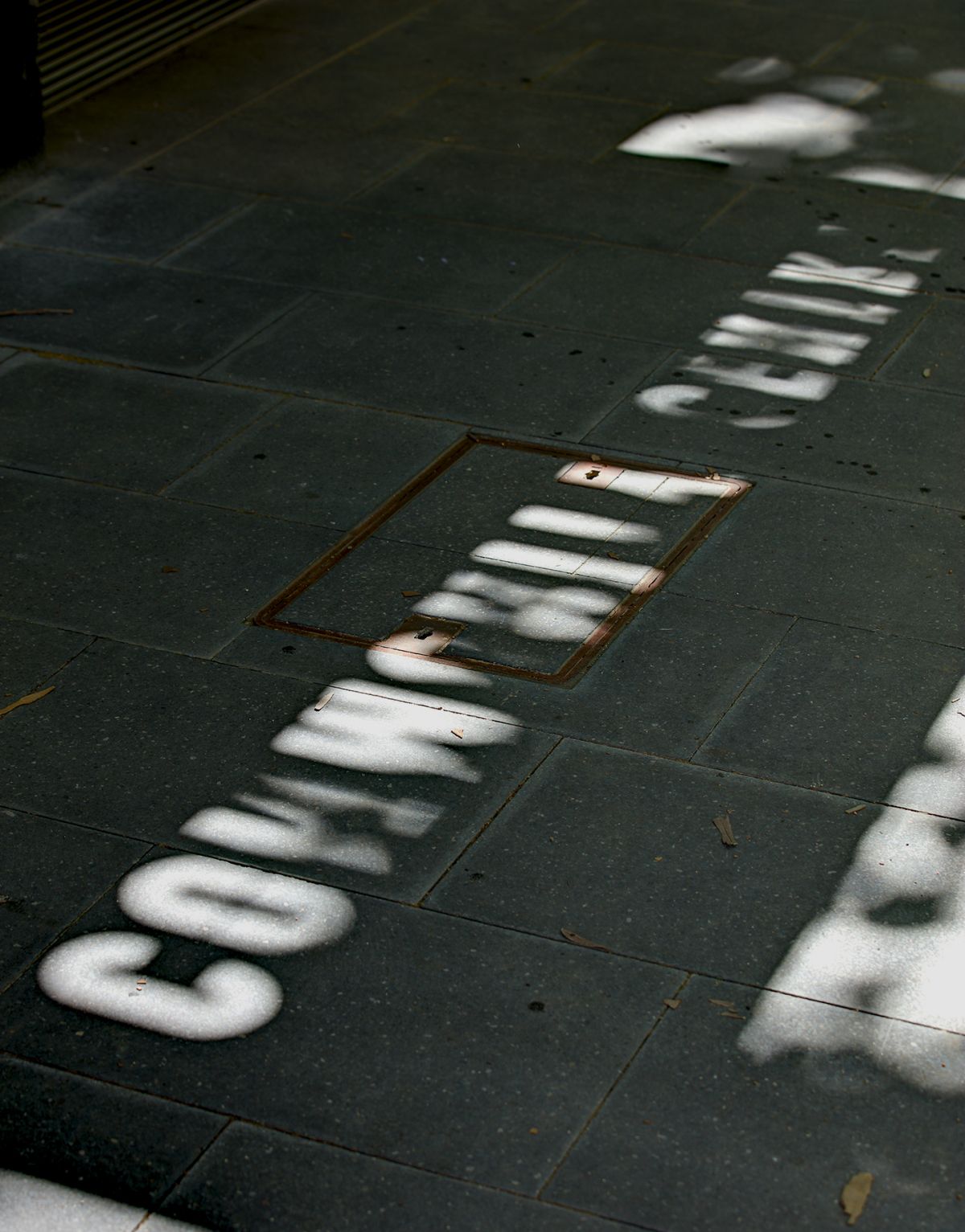 Typogrpahic 'community centre' awnings allows the sun to project messaging onto the footpath.