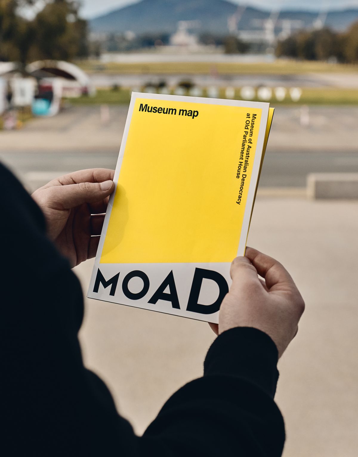 Person holding MoAD museum map.