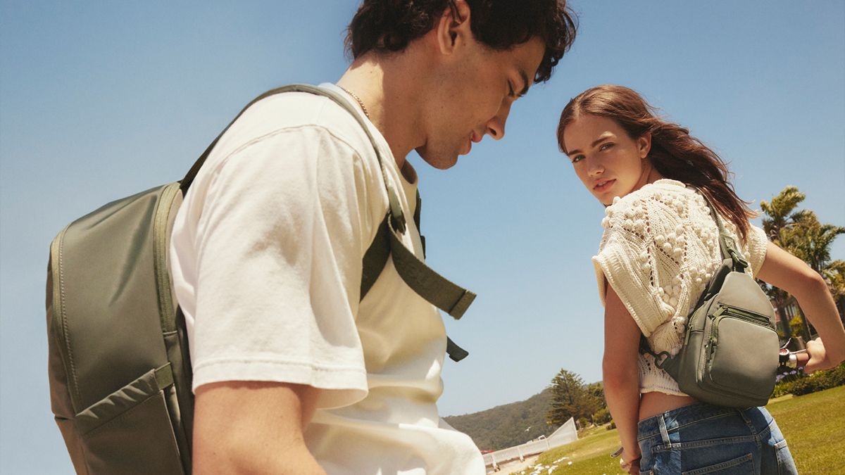 Man and woman wearing Nere bags.