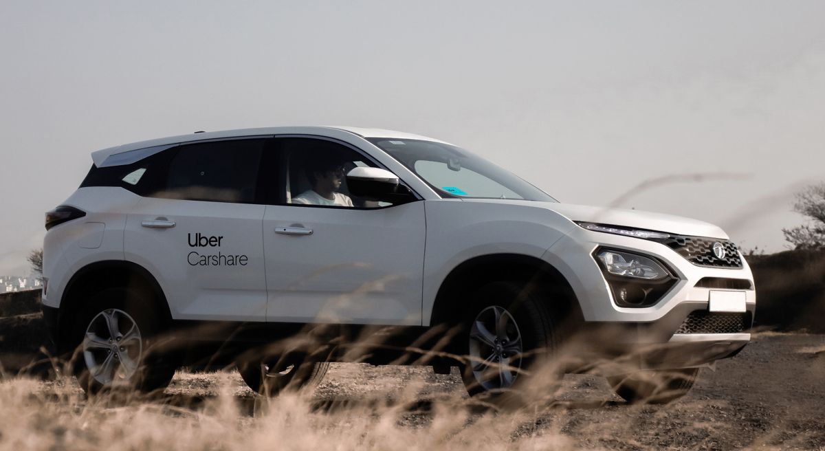 Photo of Uber Carshare White SUV parked on road